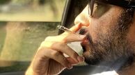 نوید محمدزاده در حال سیگار کشیدن در ماشین + عکس