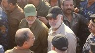 رونمایی از پوستر شهیدان سلیمانی و المهندس در عراق+ فیلم