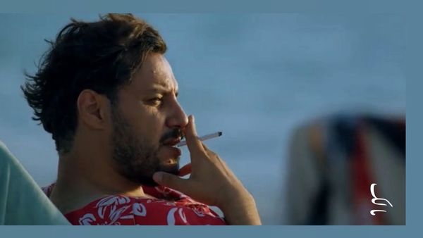 سیگار کشیدن جواد عزتی در زخم کاری + عکس