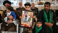 فرزند شهید امنیت در آغوش سردار سلیمانی+عکس